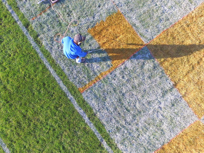 Mr. Cundiff painting end zone 